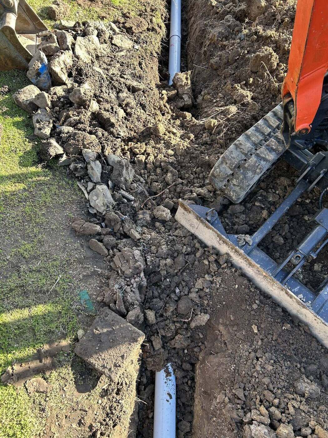 Stormwater trench, backfilled and left tidy